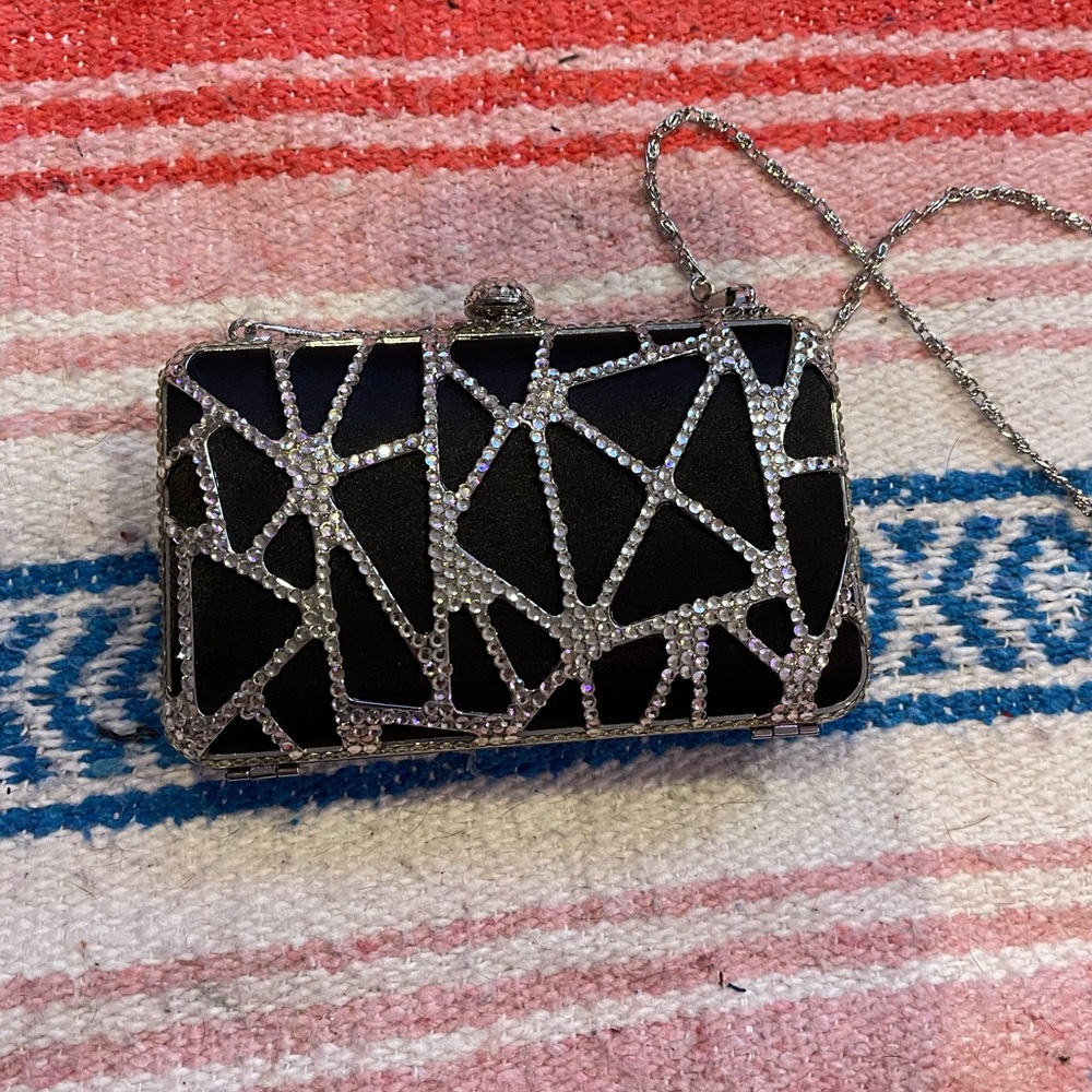 Black rhinestone clutch with chain.